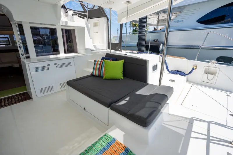  Yacht Photos Pics Spacious 2019 Lagoon 450 F yacht interior with modern seating and colorful cushions.