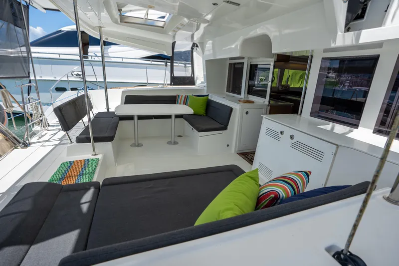  Yacht Photos Pics Spacious 2019 Lagoon 450 F yacht interior with modern seating and colorful cushions.