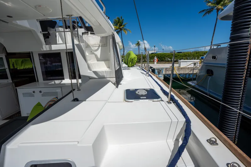  Yacht Photos Pics 2019 Lagoon 450 F catamaran docked, showcasing spacious deck and modern design.