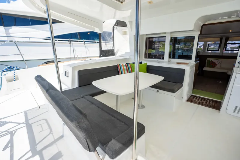  Yacht Photos Pics Spacious 2019 Lagoon 450 F yacht interior with modern seating and dining area.