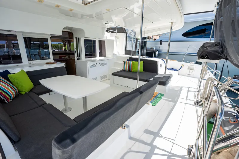  Yacht Photos Pics Spacious 2019 Lagoon 450 F yacht deck with modern seating and colorful cushions.