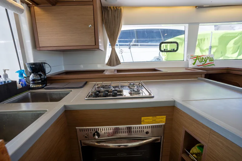  Yacht Photos Pics Modern kitchen interior of 2019 Lagoon 450 F yacht with stove and sink.