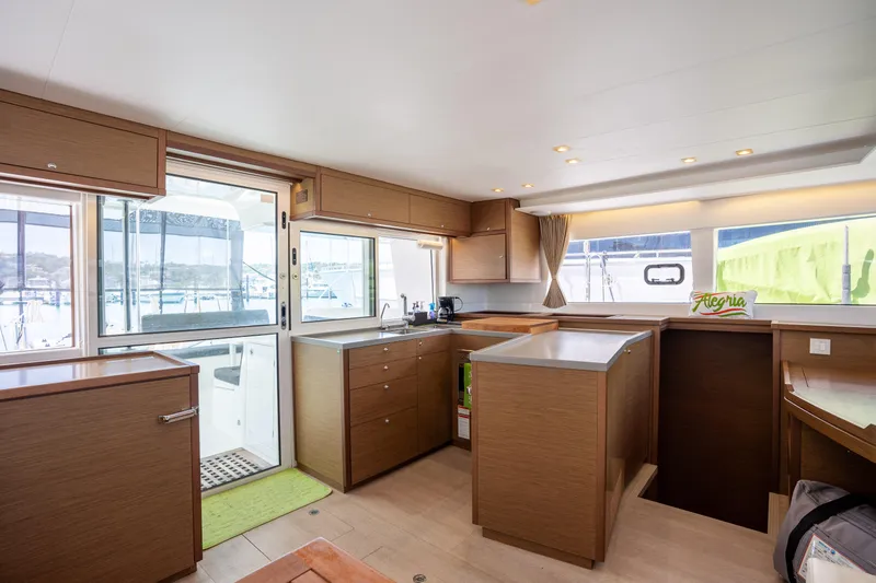  Yacht Photos Pics Interior of 2019 Lagoon 450 F catamaran with modern kitchen and ample natural light.