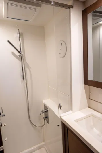  Yacht Photos Pics 2019 Lagoon 450 F yacht bathroom with modern shower and sink.