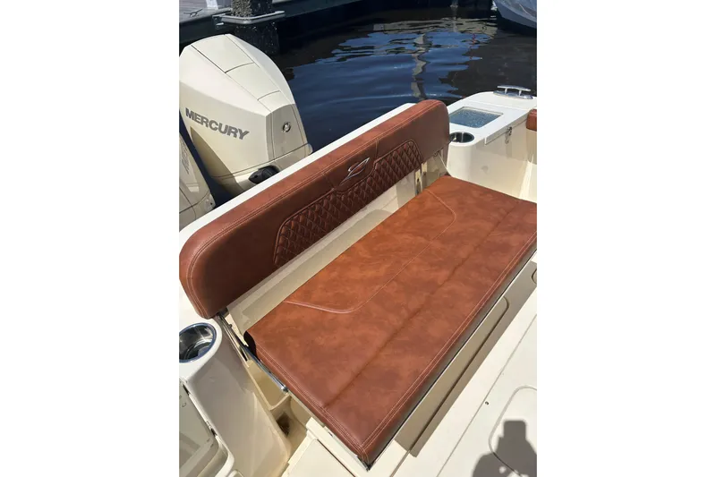  Yacht Photos Pics 2025 Scout 277 LXF boat with brown leather seating and Mercury engine.