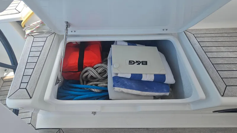 Acadia Yacht Photos Pics Storage compartment on a 2016 Hanse 415 yacht with ropes and equipment.