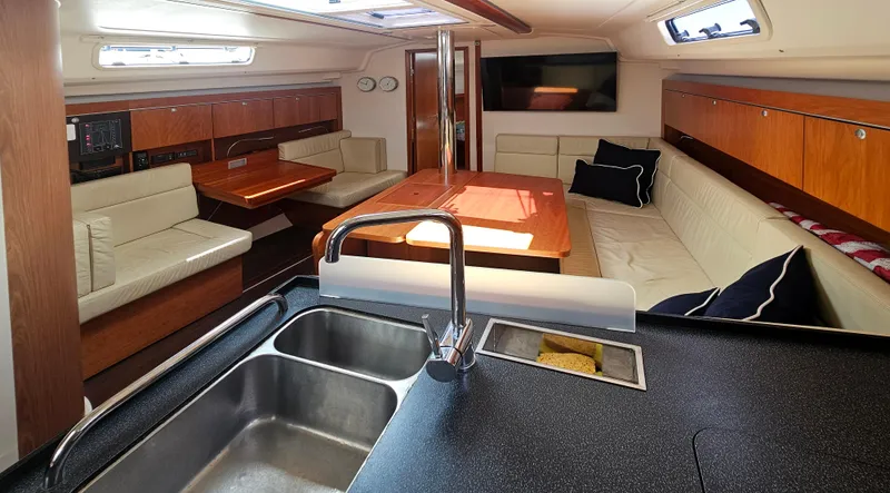 Acadia Yacht Photos Pics Interior of 2016 Hanse 415 yacht with modern kitchen and cozy seating area.