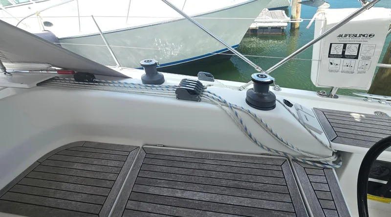 Acadia Yacht Photos Pics 2016 Hanse 415 sailboat deck with winches and ropes in a marina setting.