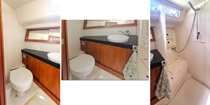 Acadia Yacht Photos Pics 2016 Hanse 415 yacht bathroom with wooden cabinetry, sink, toilet, and shower area.