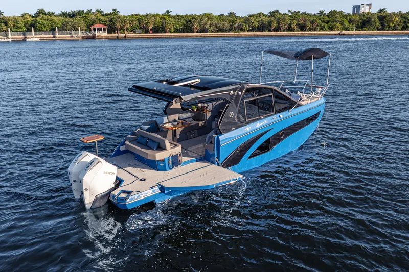  Yacht Photos Pics 2026 Hanover 347 boat cruising on a serene waterway, featuring sleek design and modern amenities.