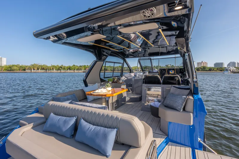  Yacht Photos Pics Luxurious 2026 Hanover 347 yacht interior with elegant seating and dining area on the water.