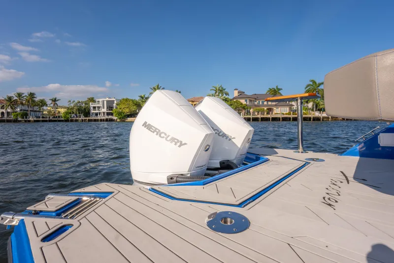  Yacht Photos Pics 2026 Hanover 347 boat with dual Mercury outboard engines on a sunny waterfront.