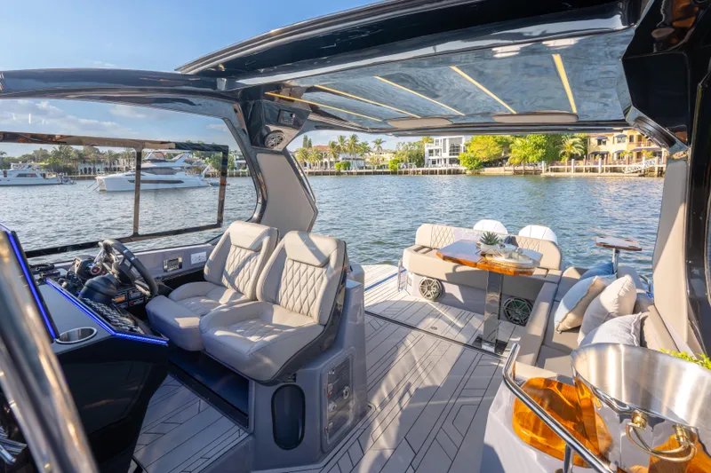  Yacht Photos Pics Luxurious 2026 Hanover 347 yacht interior with plush seating and elegant design on a sunny day.