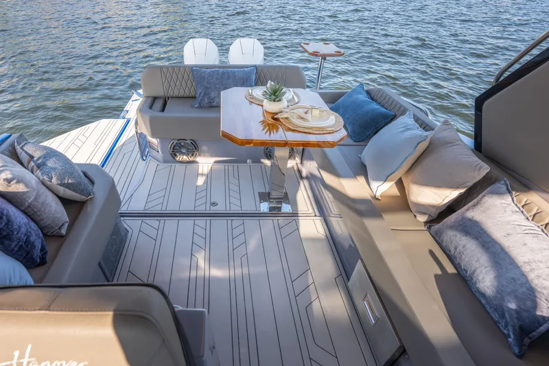  Yacht Photos Pics Luxurious 2026 Hanover 347 boat interior with elegant seating and stylish decor on the water.