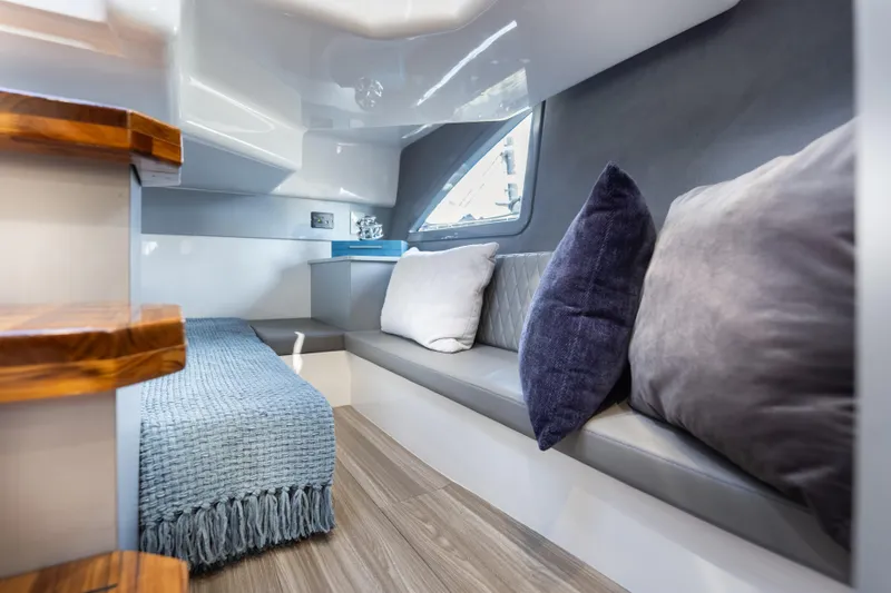  Yacht Photos Pics Luxurious interior of 2026 Hanover 347 yacht with cozy seating and elegant decor.