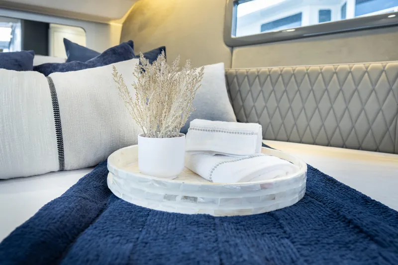  Yacht Photos Pics Luxurious interior of 2026 Hanover 347 with elegant bedding and decor accents.