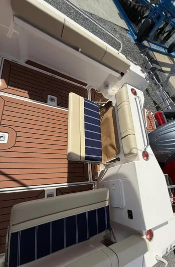 Yacht Photos Pics 2023 Ranger Tugs R-25 boat deck with seating and wood finish.