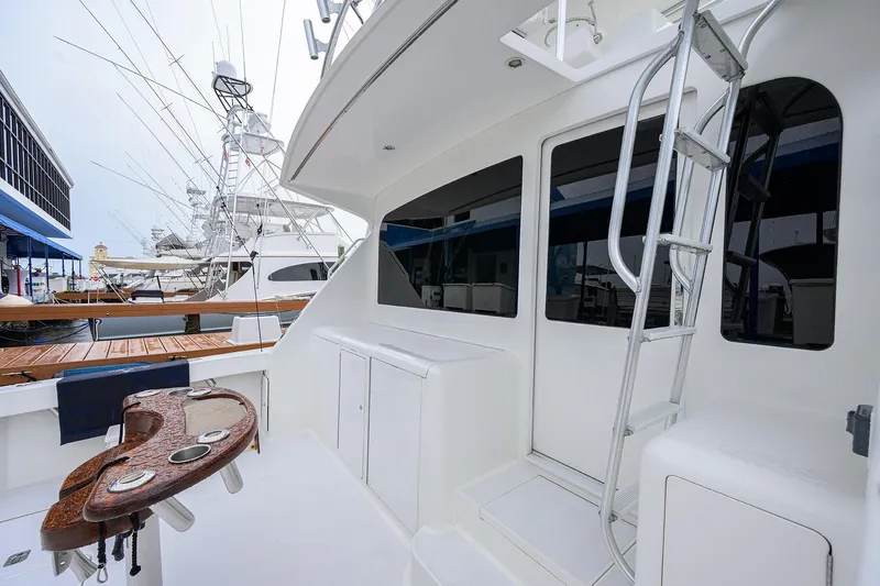 Island Girl Yacht Photos Pics 2004 Viking 48 Convertible yacht deck with ladder and fishing station.