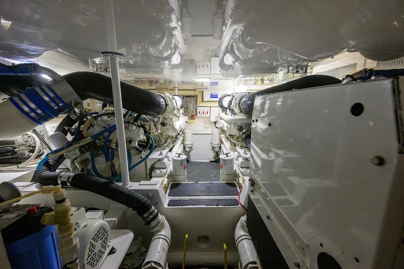 Island Girl Yacht Photos Pics Engine room of 2004 Viking 48 Convertible yacht, showcasing machinery and components.