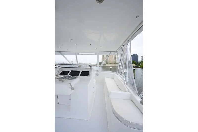 Island Girl Yacht Photos Pics 2004 Viking 48 Convertible yacht interior with helm and seating area.