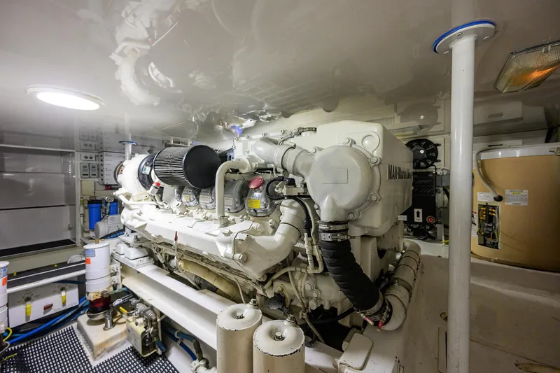 Island Girl Yacht Photos Pics Engine room of 2004 Viking 48 Convertible yacht, showcasing a powerful marine engine.