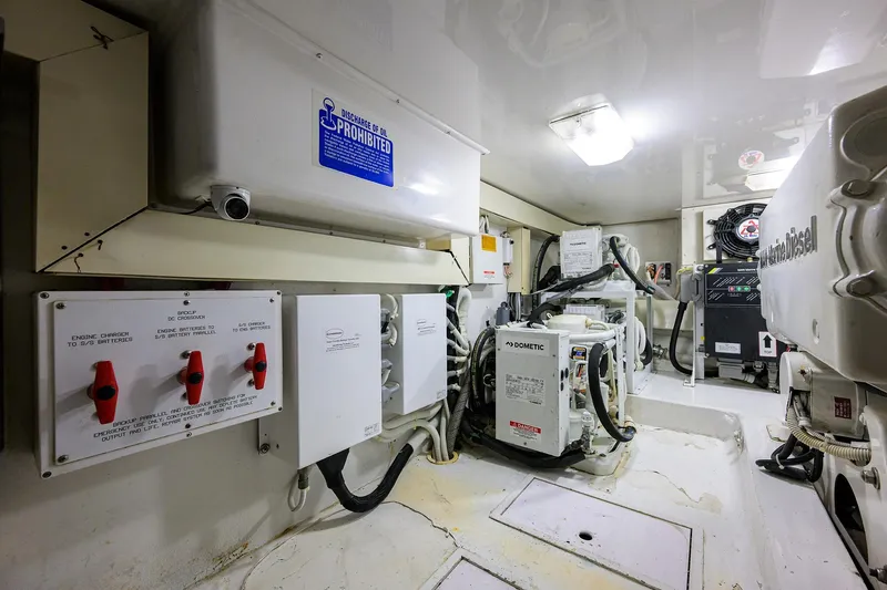 Island Girl Yacht Photos Pics Engine room of 2004 Viking 48 Convertible yacht, featuring control panels and equipment.