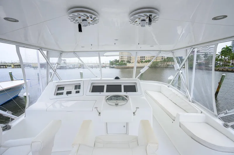 Island Girl Yacht Photos Pics 2004 Viking 48 Convertible yacht helm with modern controls and panoramic marina view.