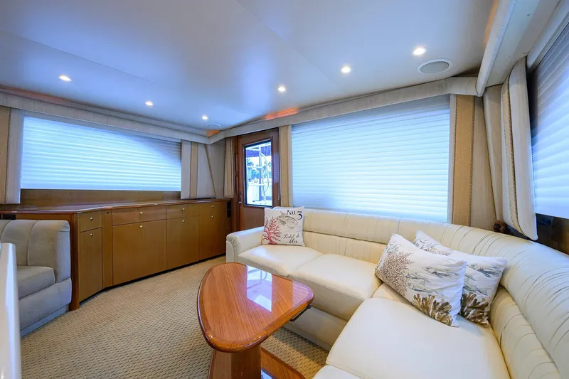 Island Girl Yacht Photos Pics Luxurious interior of 2004 Viking 48 Convertible yacht with elegant seating and decor.