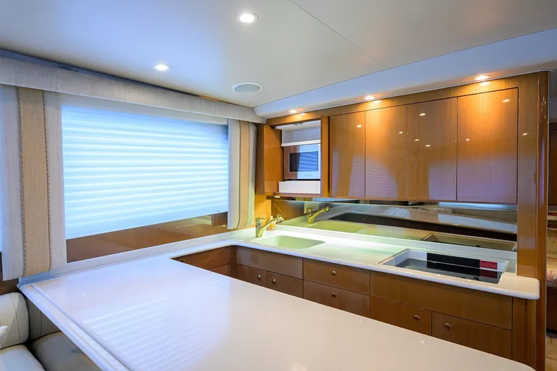 Island Girl Yacht Photos Pics Luxurious kitchen interior of 2004 Viking 48 Convertible yacht with modern amenities.