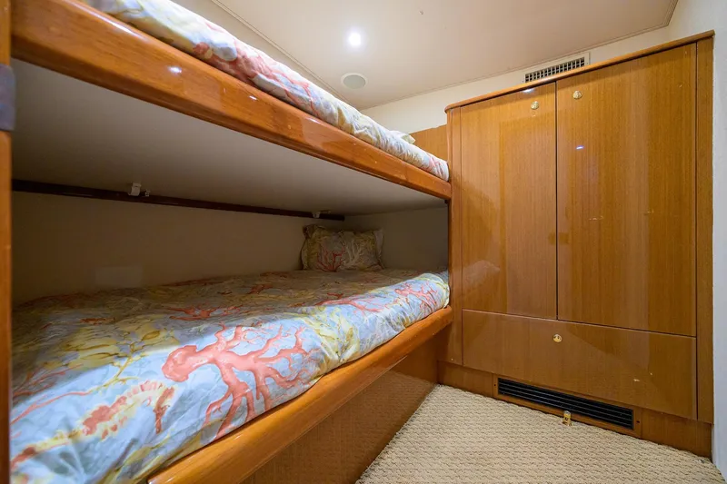 Island Girl Yacht Photos Pics Bunk beds in 2004 Viking 48 Convertible yacht cabin with wooden cabinetry.