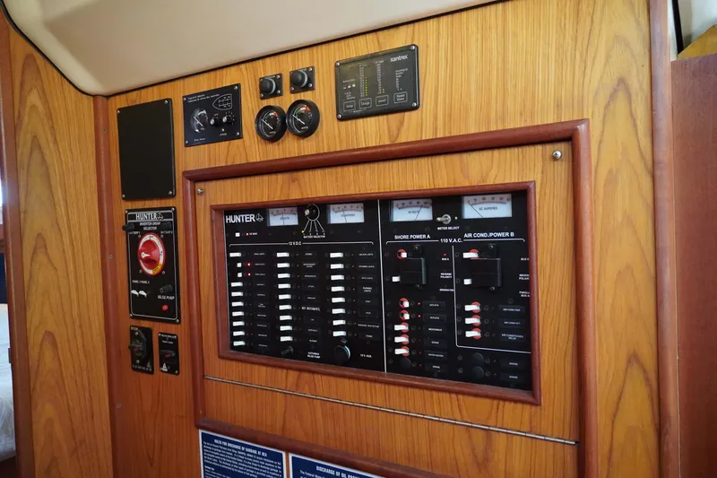 Skippers Dream Yacht Photos Pics Control panel of a 2000 Hunter Passage 420 sailboat, featuring various switches and gauges.