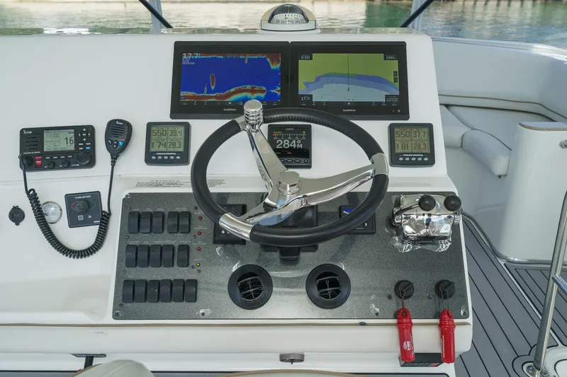 Nauti Pops Yacht Photos Pics 2007 Silverton Convertible yacht helm with advanced navigation and control systems.
