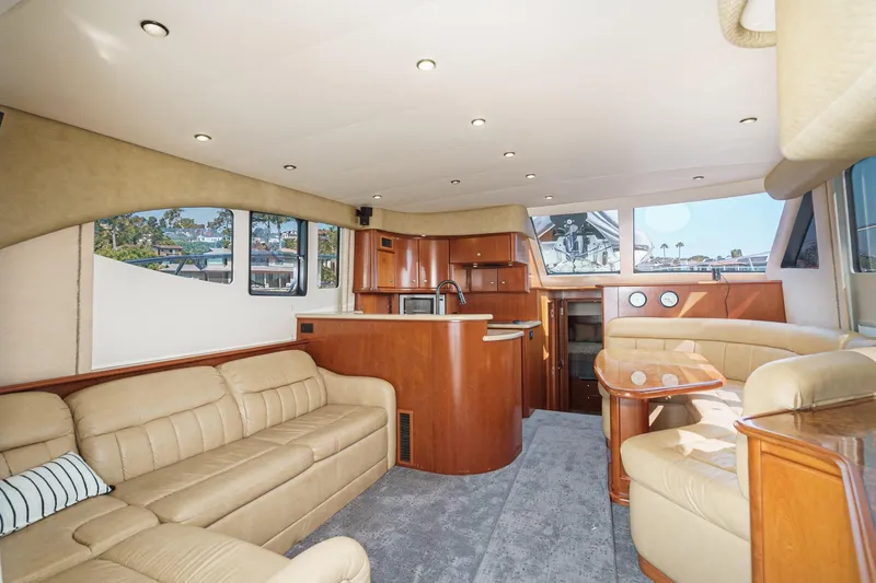Nauti Pops Yacht Photos Pics Luxurious interior of a 2007 Silverton Convertible yacht with plush seating and modern amenities.