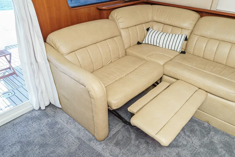 Nauti Pops Yacht Photos Pics Luxurious beige leather recliner sofa in 2007 Silverton Convertible yacht interior.