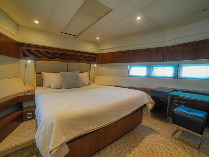 Yolo Yacht Photos Pics Luxurious bedroom interior of 2014 Fairline 50 yacht with modern design and cozy ambiance.