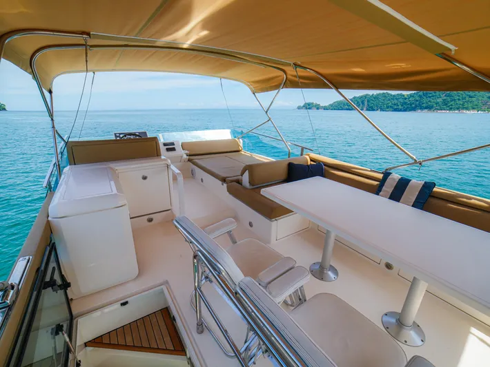Yolo Yacht Photos Pics Luxurious 2014 Fairline 50 yacht interior with seating, table, and ocean view.