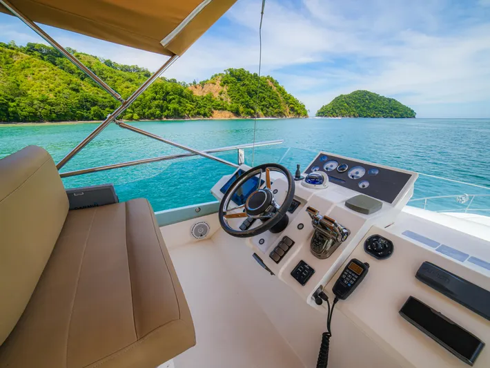 Yolo Yacht Photos Pics Fairline 50 yacht helm, 2014 model, with ocean and island view.