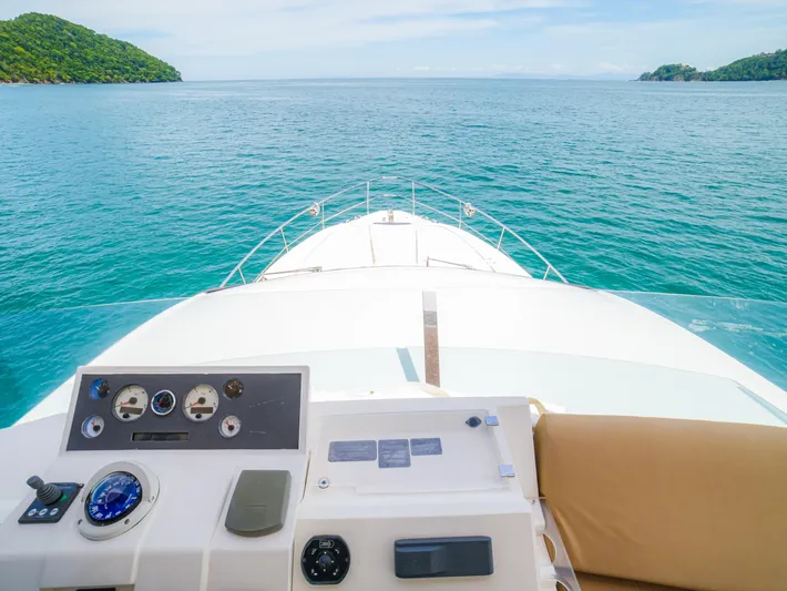 Yolo Yacht Photos Pics Fairline 50 yacht dashboard overlooking serene ocean and lush islands, 2014 model.