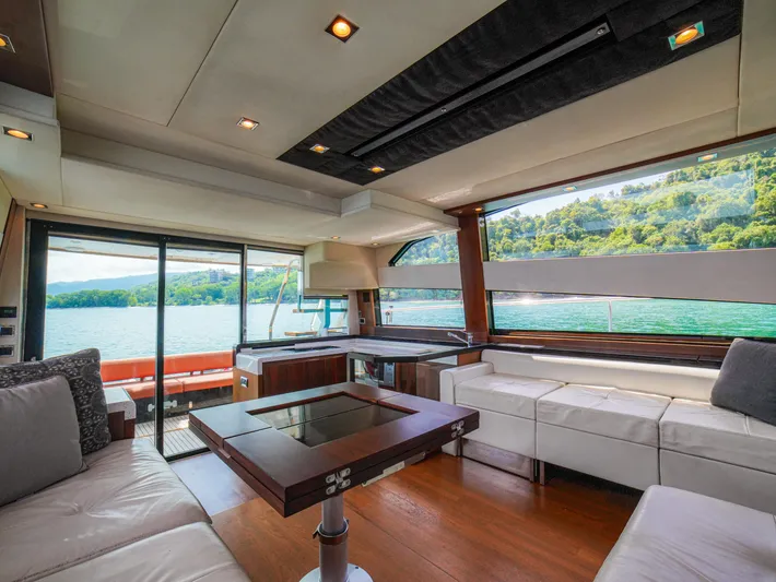 Yolo Yacht Photos Pics Luxurious interior of 2014 Fairline 50 yacht with scenic lake view.