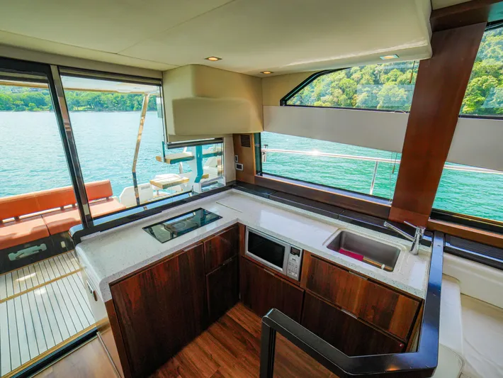 Yolo Yacht Photos Pics Luxurious Fairline 50 yacht kitchen interior with scenic water view, 2014 model.