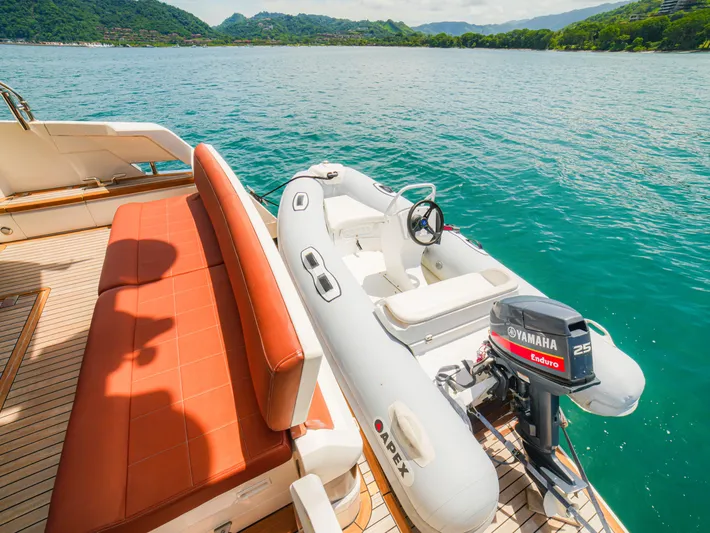 Yolo Yacht Photos Pics Fairline 50 yacht deck with inflatable boat and Yamaha motor, 2014 model, on scenic water.