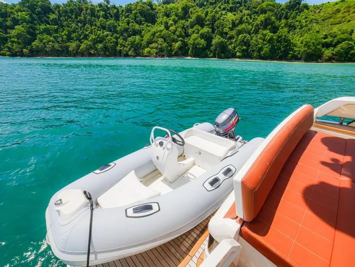 Yolo Yacht Photos Pics Fairline 50 yacht with inflatable boat on turquoise water, 2014 model.