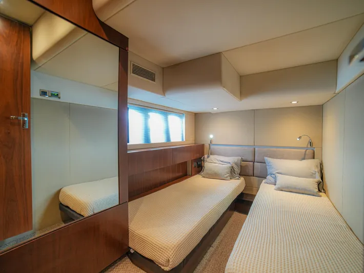 Yolo Yacht Photos Pics Luxurious cabin interior of 2014 Fairline 50 yacht with twin beds and modern decor.