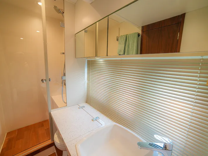 Yolo Yacht Photos Pics Modern bathroom interior on 2014 Fairline 50 yacht with shower and sink.