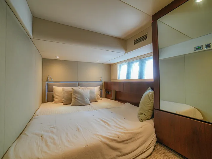 Yolo Yacht Photos Pics Luxurious bedroom interior of 2014 Fairline 50 yacht with cozy bedding and modern design.