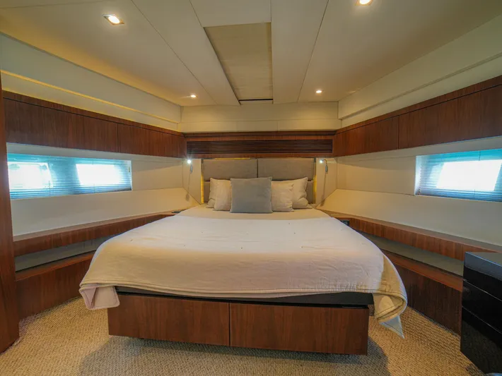 Yolo Yacht Photos Pics Luxurious bedroom interior of 2014 Fairline 50 yacht with modern design and cozy lighting.