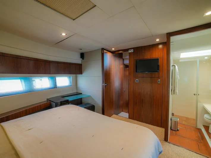 Yolo Yacht Photos Pics Luxurious Fairline 50 yacht bedroom interior, 2014 model, featuring modern design and ensuite bathroom.