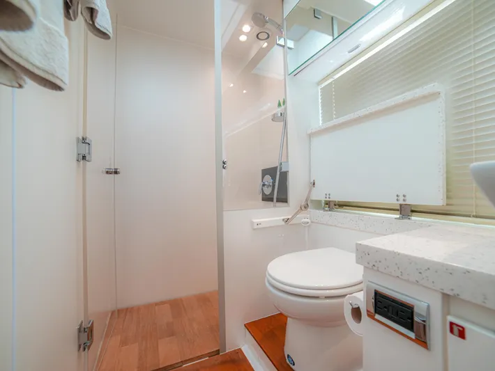 Yolo Yacht Photos Pics Modern bathroom on 2014 Fairline 50 yacht with shower and toilet.