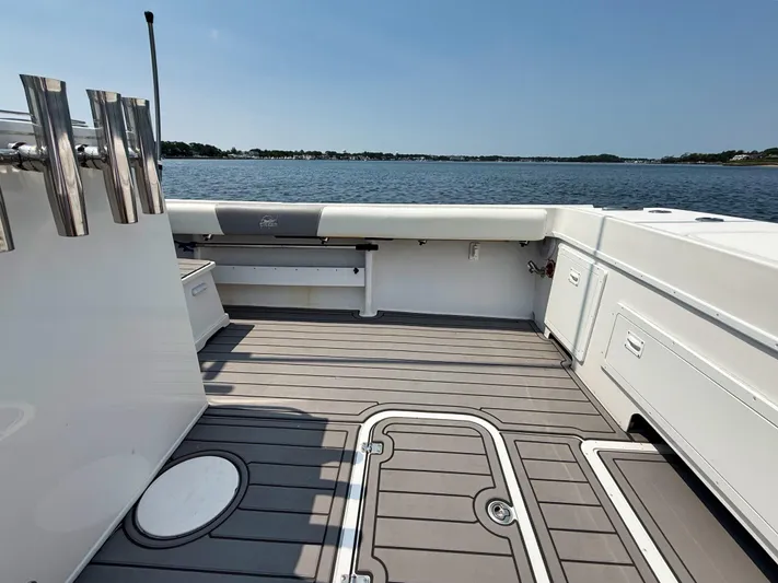  Yacht Photos Pics 2021 Steiger Craft 31 Chesapeake boat deck with rod holders, overlooking calm waters.