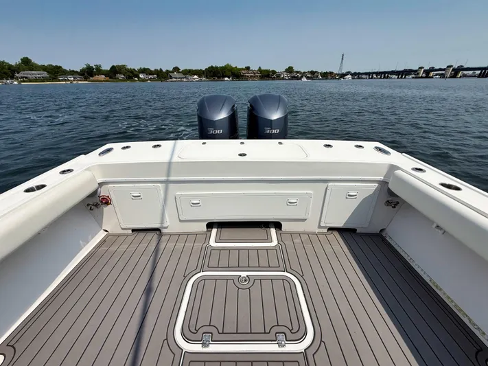  Yacht Photos Pics 2021 Steiger Craft 31 Chesapeake boat deck with twin 300 engines on calm water.